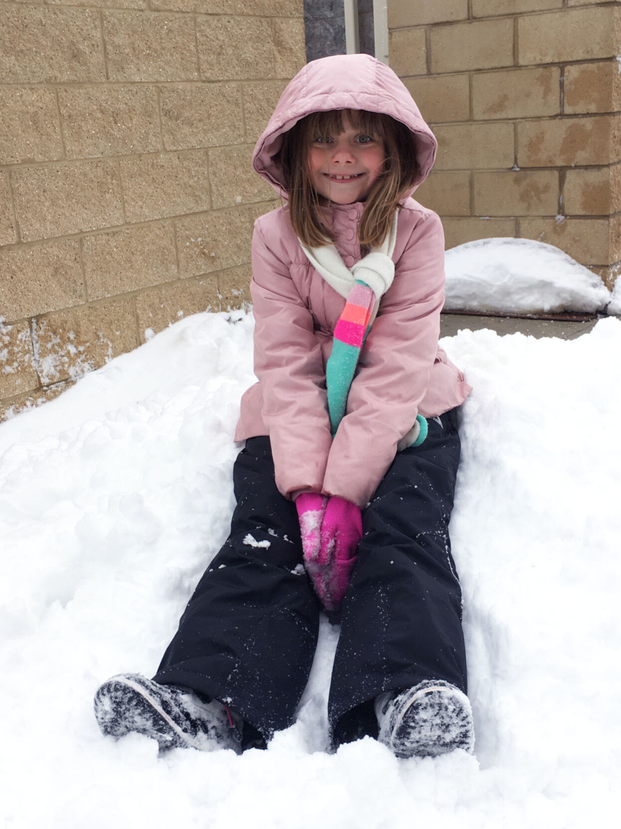 Olivia Buford, 8, of Burlington plays in the snow